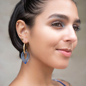 blue lucite curb link earrings on model